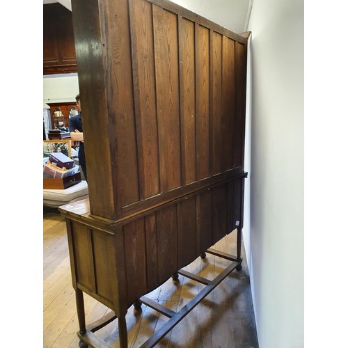 549 - An oak dresser, the top having two cupboard doors and two shelves, the base with three drawers and a... 