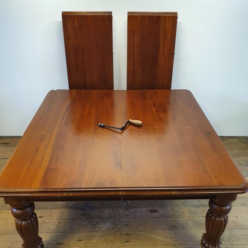 550 - A Victorian style mahogany extending dining table, with two extra leaves