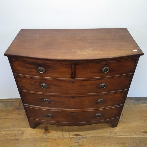 552 - A 19th century mahogany bow front chest, having two long and three short drawers, 105 cm wide, and a... 