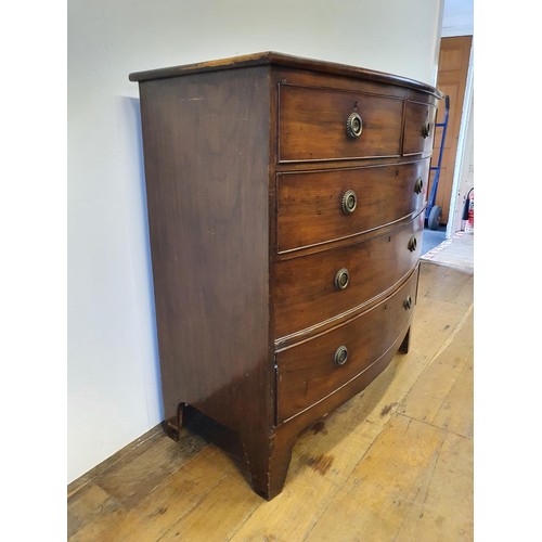 552 - A 19th century mahogany bow front chest, having two long and three short drawers, 105 cm wide, and a... 