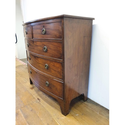 552 - A 19th century mahogany bow front chest, having two long and three short drawers, 105 cm wide, and a... 