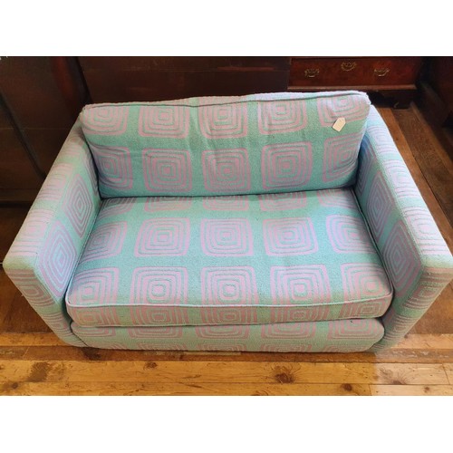 522 - A modern two seater sofa, in turquoise and purple, 129 cm wide