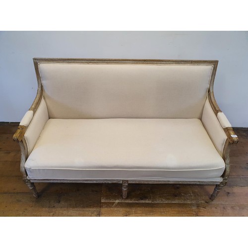 623 - A modern cream sofa with a limed oak frame, 150 cm wide