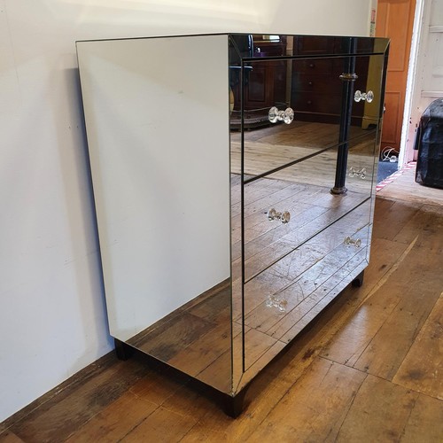 517 - A mirrored chest of three long drawers, 100 cm wide