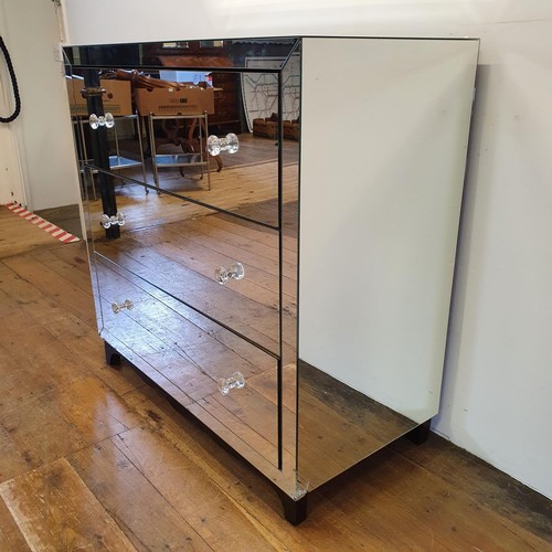 517 - A mirrored chest of three long drawers, 100 cm wide