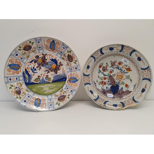 285 - A Delft polychrome plate, 38 cm diameter, and another, 35 cm diameter (2)