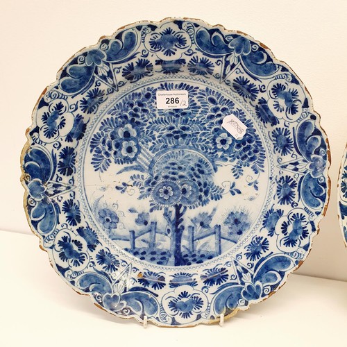 286 - A 19th century blue and white Delft plate, 35 cm diameter, and another, 35 cm diameter (2)