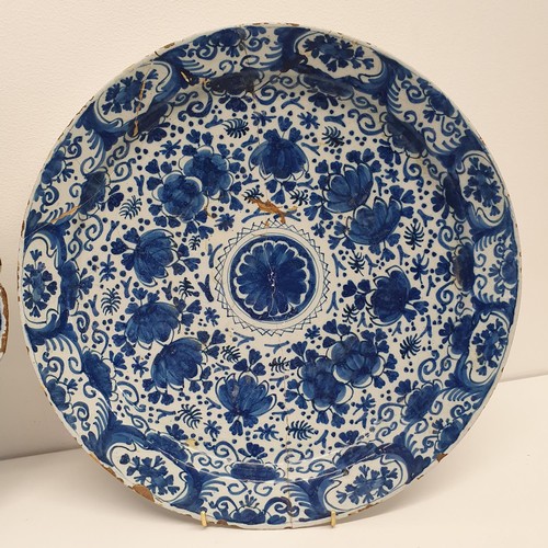 286 - A 19th century blue and white Delft plate, 35 cm diameter, and another, 35 cm diameter (2)