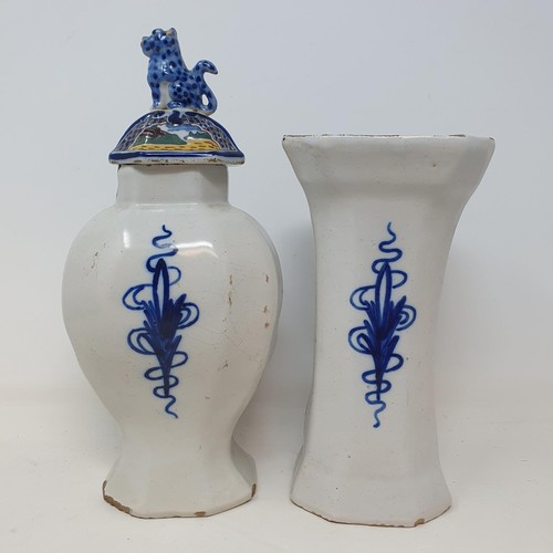 313 - A Delft polychrome vase and cover, 25 cm high, and a similar vase, 19 cm high  (2)