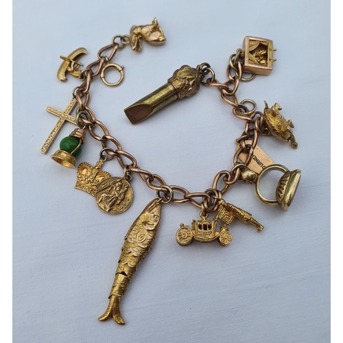 444 - A 9ct gold charm bracelet, with assorted charms, 42.7 g (all in)