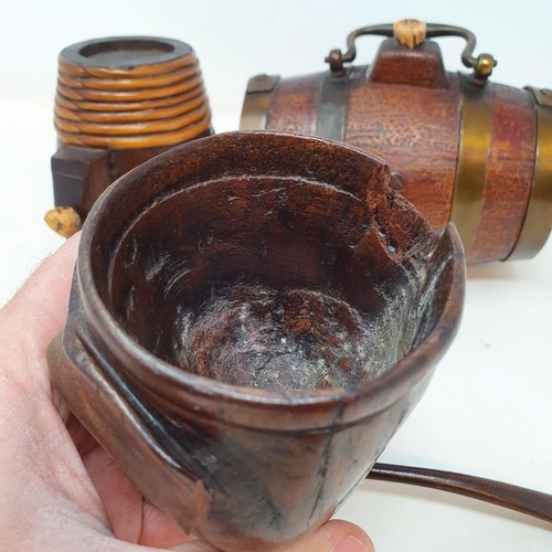 268 - A late Victorian treen stirrup cup, in the form of a dog's head, ears chipped and some loss to the r... 