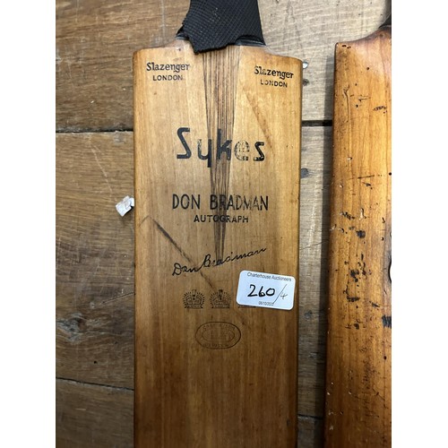 260 - A Slazenger Sykes Don Bradman cricket bat, and three other vintage cricket bats (4)