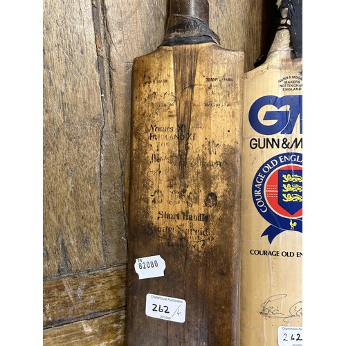 262 - A Gunn & Moore cricket bat with signatures, and three vintage cricket bats (4)