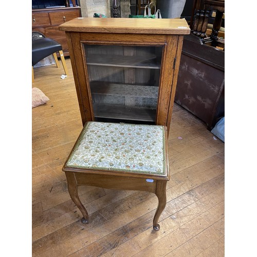 602 - An oak glazed bookcase, 61 cm wide, two other bookcases, an oak drop leaf table, an oak tray, a shel... 