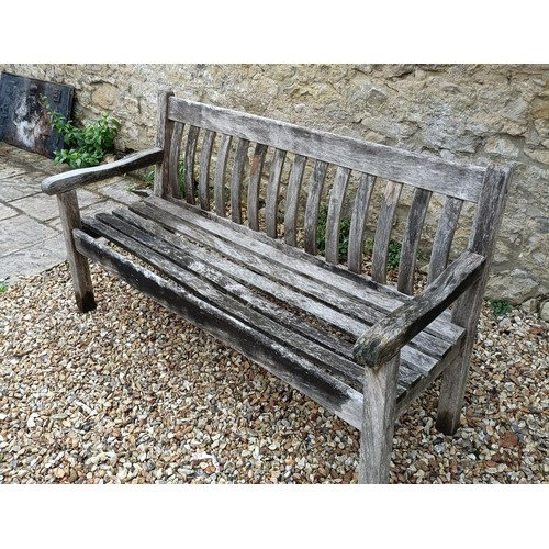 620 - A teak garden bench, 153 cm wide