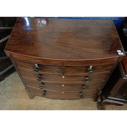 638 - A 19th century mahogany bow front chest, having two short and three long drawers, with carved horn h... 