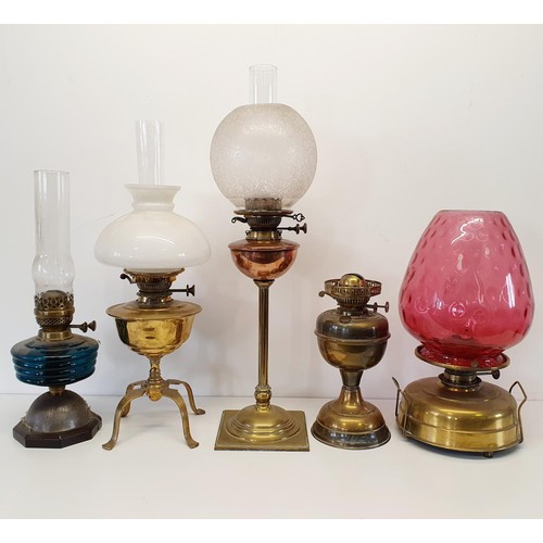 363 - A brass oil lamp base, four others similar, three glass shades and three glass chimneys (2 boxes)