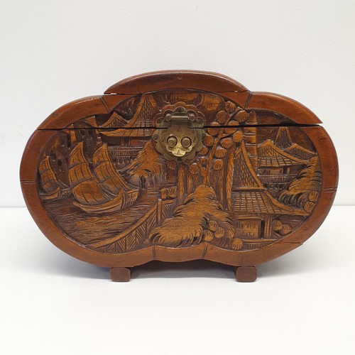 364 - A carved camphorwood box, 33 cm wide