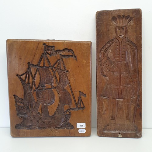 368 - A treen cookie mould, carved figure of a man, 55 cm, and another, carved in the form of a galleon (2... 