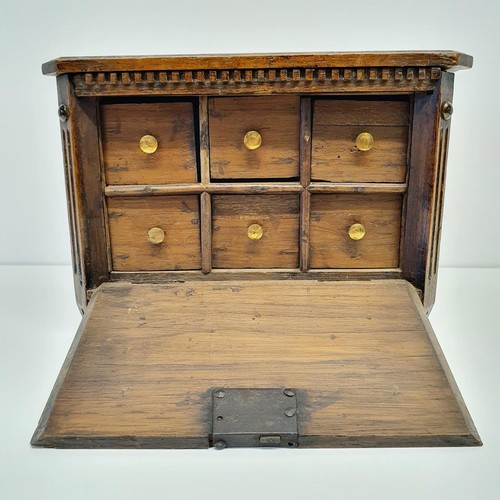 387 - A Dutch table top collectors cabinet, the fall front to reveal six drawers, 27 cm wide,