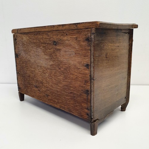 387 - A Dutch table top collectors cabinet, the fall front to reveal six drawers, 27 cm wide,