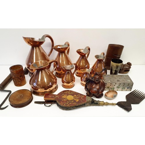 428 - A group of copper harvest type measures, two wooden jigsaw puzzles, a pair of bellows, and other ite... 