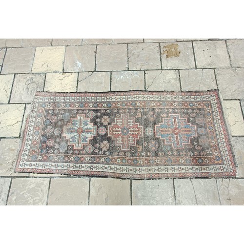 533 - A Persian brown ground runner, 240 x 110 cm