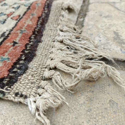 533 - A Persian brown ground runner, 240 x 110 cm