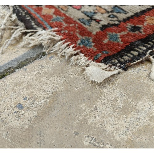 533 - A Persian brown ground runner, 240 x 110 cm