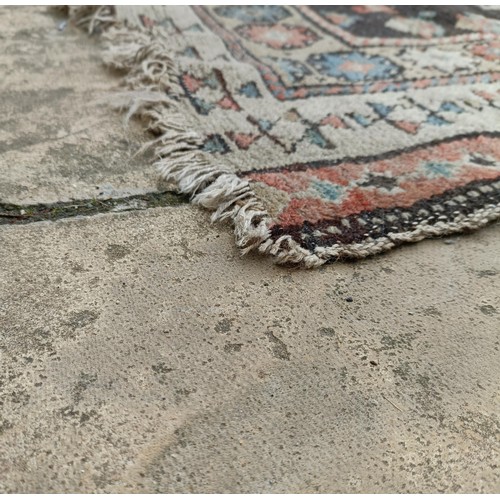 533 - A Persian brown ground runner, 240 x 110 cm