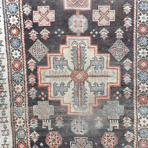 533 - A Persian brown ground runner, 240 x 110 cm