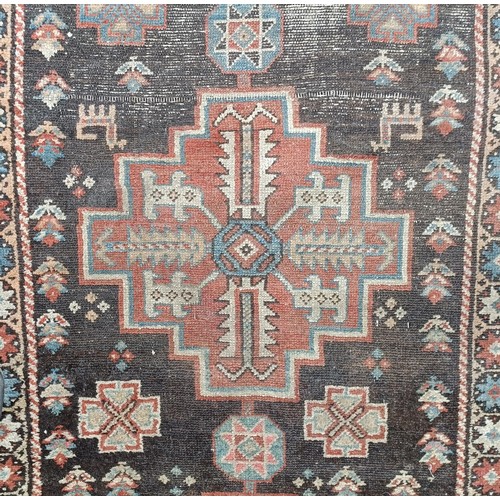 533 - A Persian brown ground runner, 240 x 110 cm