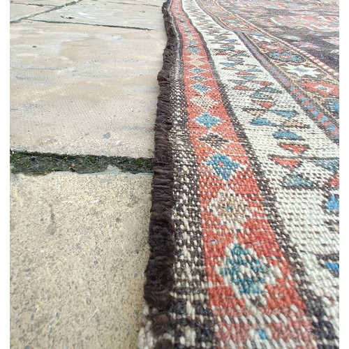 533 - A Persian brown ground runner, 240 x 110 cm