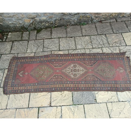 534 - A Persian red ground runner, 300 x 100 cm