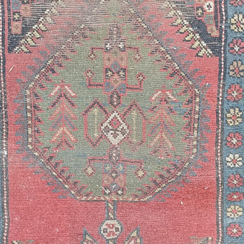 534 - A Persian red ground runner, 300 x 100 cm