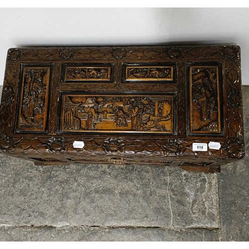 518 - A Chinese carved camphorwood box, 70 cm