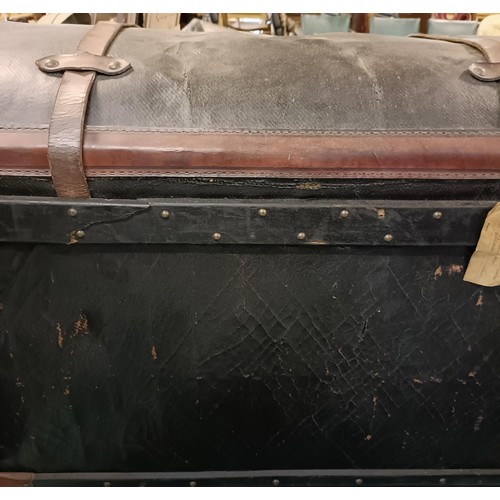 521 - A leather and canvas dome topped trunk, 185 cm wide