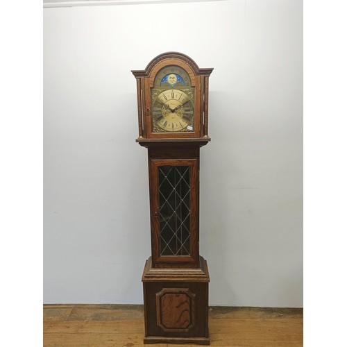 505 - A modern oak longcase clock, by Fenclocks, 189 cm high, and an oak hall stand (2)