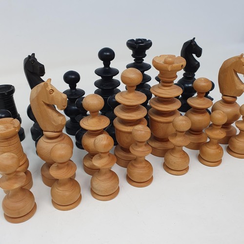 360 - A turned wood chess set, the king being 10 cm high, in a pine box, incomplete