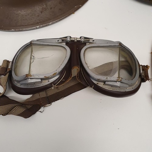 381 - A lobster tail helmet, a WW2 US military helmet, a flying cap and goggles and a straw boater (box)