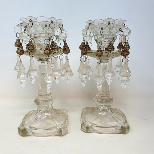 393 - A pair of glass table lustres, 20 cm high, and two spare sets of drops (2)