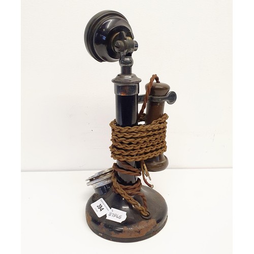 394 - An early 20th century stick telephone, 33 cm high