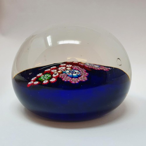 413 - A glass paperweight, decorated a butterfly, 7.5 cm diameter