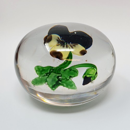 414 - A glass paperweight, decorated a Violet, possibly Baccarat, 6.5 cm diameter