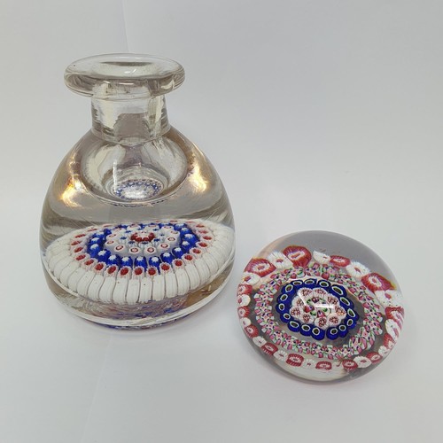 415 - A glass milleflori paperweight, 7 cm diameter, and a similar inkwell, cracked (2)