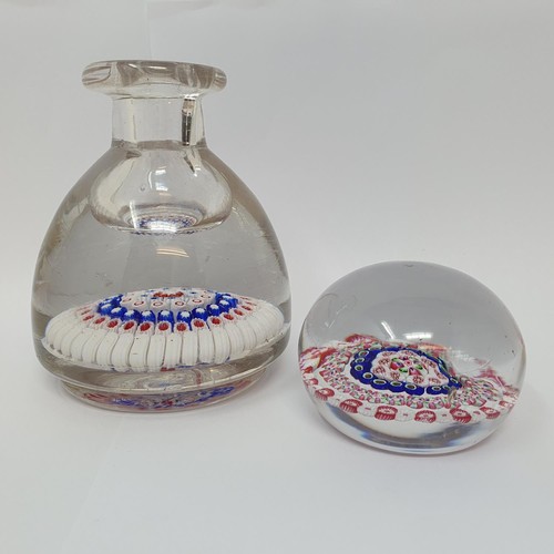 415 - A glass milleflori paperweight, 7 cm diameter, and a similar inkwell, cracked (2)