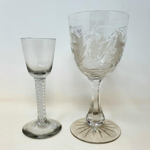 417 - A cordial glass, with a double cotton twist stem, 15.5 cm high, and a Victorian cut and etched glass... 