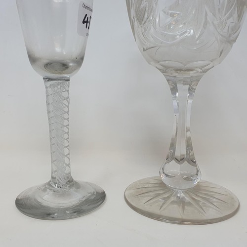 417 - A cordial glass, with a double cotton twist stem, 15.5 cm high, and a Victorian cut and etched glass... 