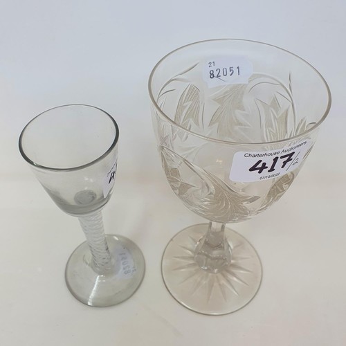 417 - A cordial glass, with a double cotton twist stem, 15.5 cm high, and a Victorian cut and etched glass... 