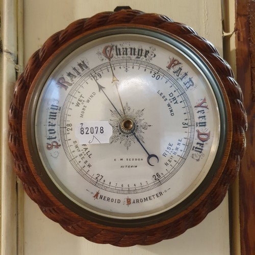 391 - A barometer, in a rosewood case, 82 cm high, and another, 23 cm diameter (2)